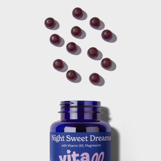 Vitawell Night Sweet Dreams Gummies pouring out of the bottle