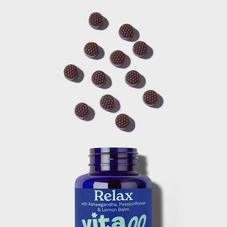 Vitawell relax gummies pouring out of the bottle