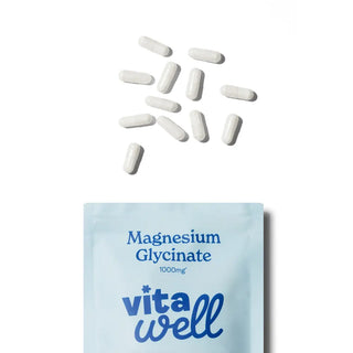 Vitawell magnesium glycinate supplement packaging with scattered capsules 