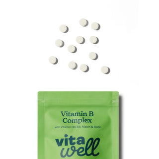 Vitawell Vitamin B Complex packaging with scattered tablets 