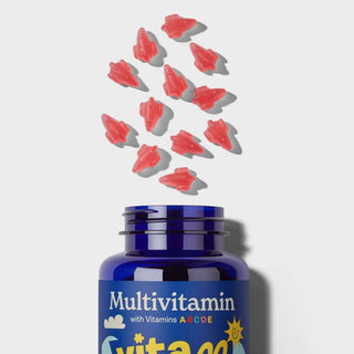 Vitawell kids multi vitamin bottle with red gummy vitamins on a light grey background