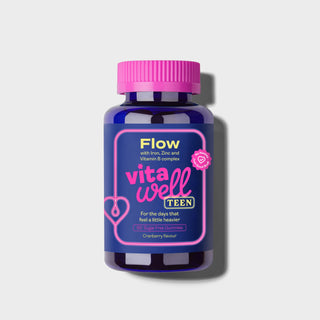 Vitawell Teen supplement bottle with pink cap on a light grey background